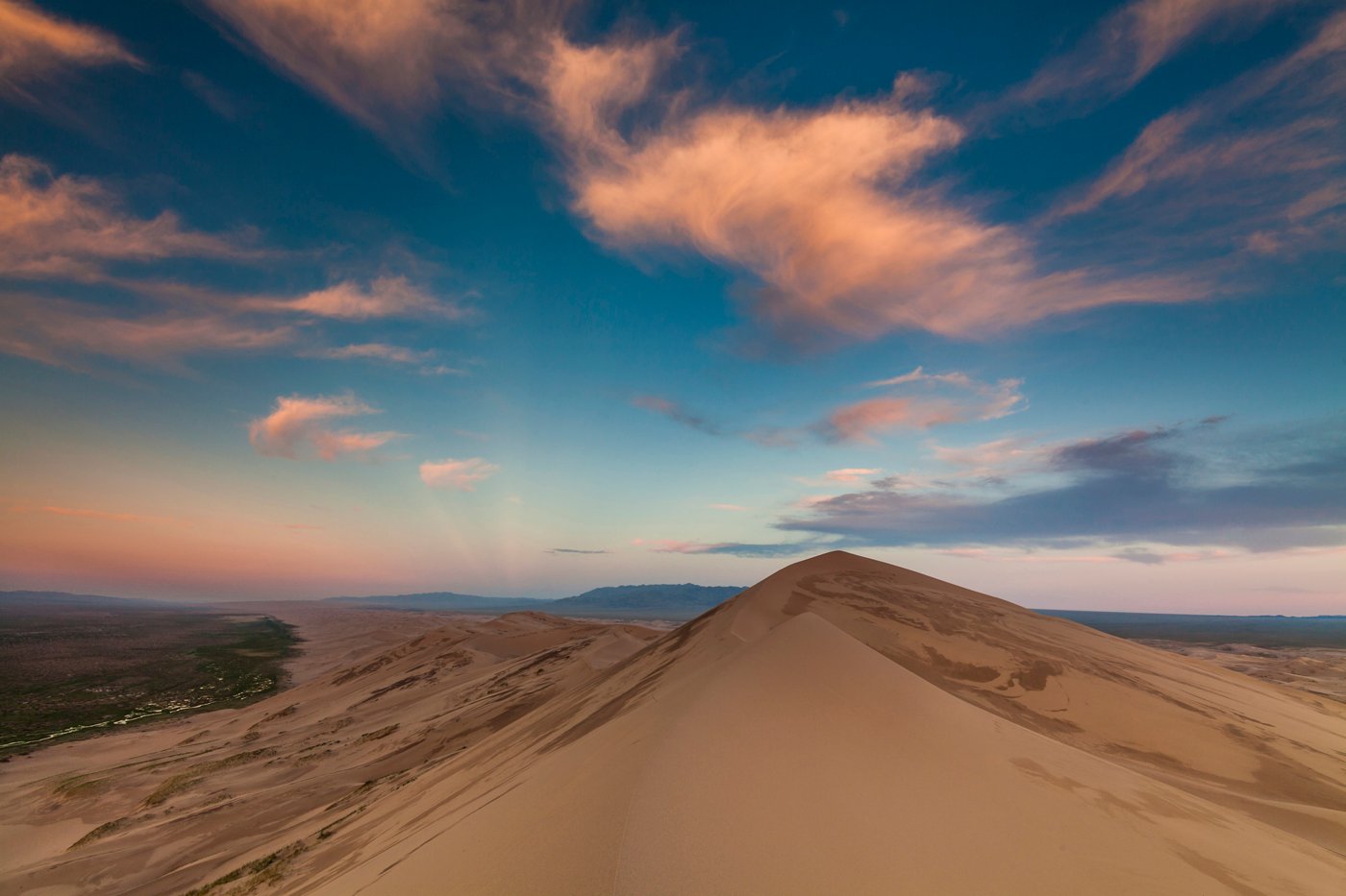 Colorful sunset over the dunes of the Gobi Desert. Mongolia.